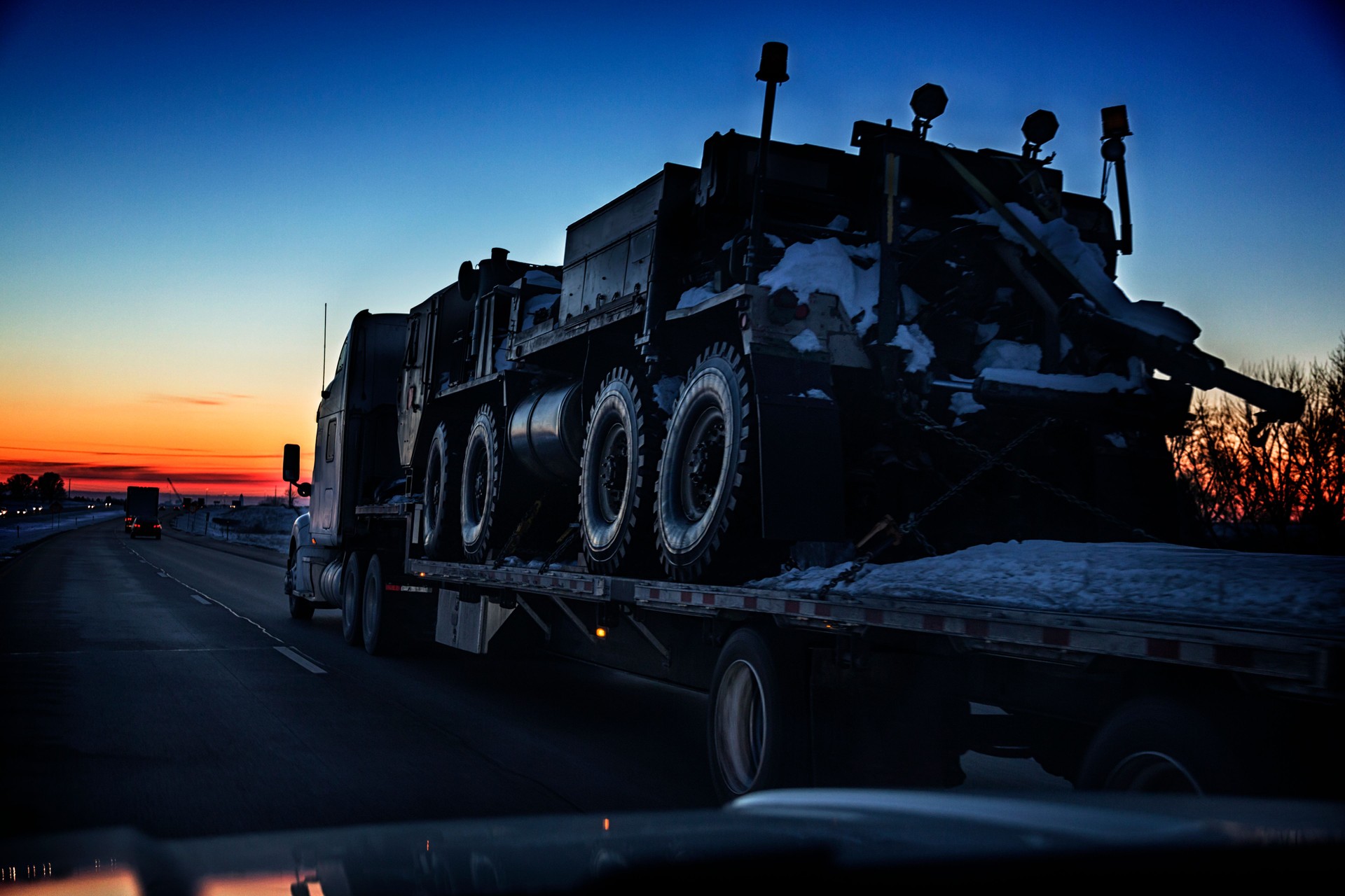 USA Army Tactical Armored Military Vehicle Transported on Flatbed Trailer